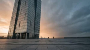 Monumental corporate headquarters under dramatic stormy sky representing large-cap company stability during market turbulence